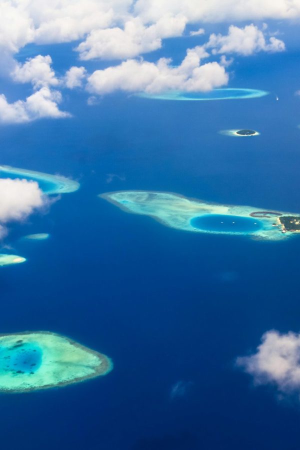 pexels-photo-1450355-1450355 A breathtaking aerial view of tropical islands and azure blue waters, showcasing stunning natural beauty.